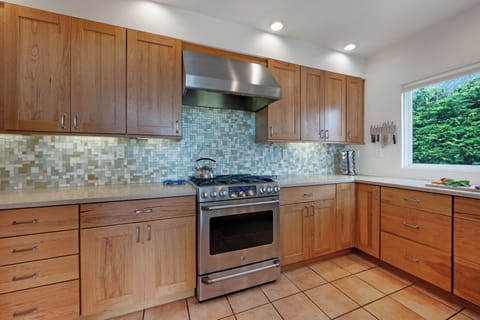 The gourmet kitchen is equipped with all the utensils, pots, pans, dishes you'll need, and more.