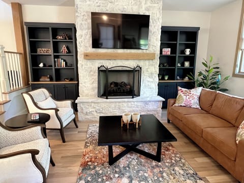 Family room with gas fireplace, smart TV, and bluetooth receiver and speakers