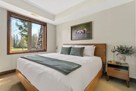 Second bedroom with a king bed, Smart TV & ensuite bathroom.