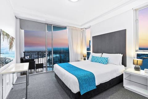 The primary bedroom comes with a queen-sized bed, second TV and access to a second balcony where you can soak up breezy, riverfront vistas.