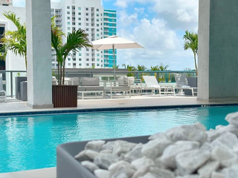 Rooftop Pool Area | Features two heated pools + lounge.
