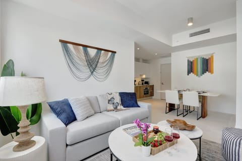 Living Room | Open concept layout, features city views, pull-out sofa and smart tv.