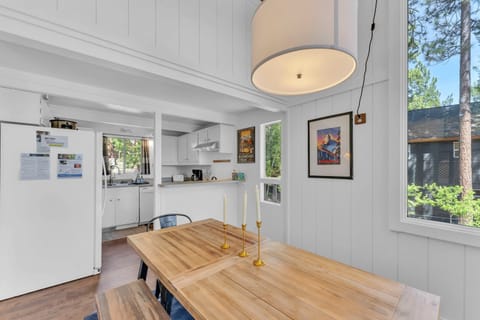 Dining Room: 6-person dining table, soaring windows, access to deck, located between the living room and kitchen