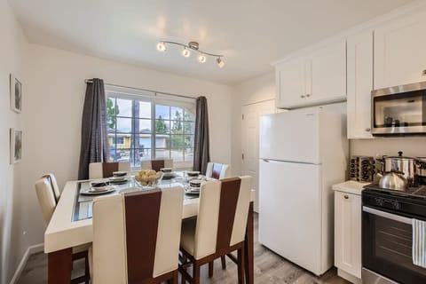 Enjoy the full kitchen & 6 person dining area w/ a refrigerator, freezer, oven, stove, microwave, dishwasher, coffee, creamers, mixers, spice pots, pans, cooking supplies, cutlery, cups, plates, bowls, utensils, small appliances, and more essentials.