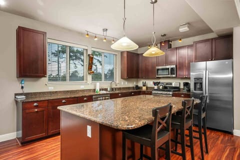 You’ll fall in love with the open kitchen, complete with hardwood floors, stainless steel appliances, a dream space for cooking and entertaining.