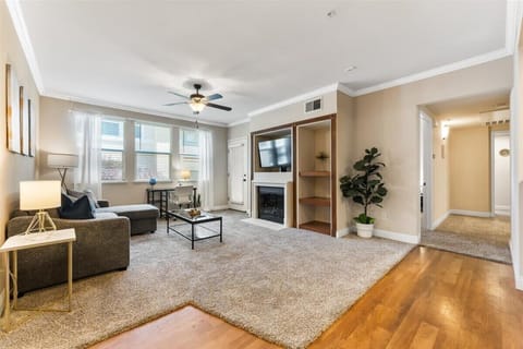 Cozy up by the relaxing fireplace in the living room. 