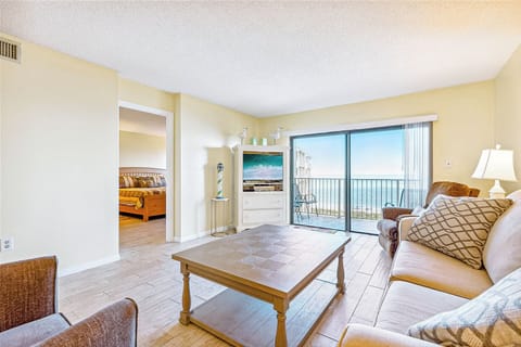 Relax in a bright, cozy living room with stunning ocean views.