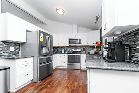 Kitchen is stocked to serve 12 with an overflow pantry next to the laundry