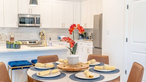 Dine in style in a beautifully appointed dining room with a large table and comfortable seating, ideal for memorable meals after a day of fun in Arlington's entertainment district.