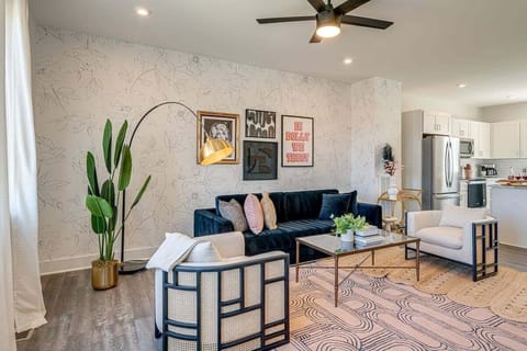 Bright and open living space complete with designer furnishings and smart TV.