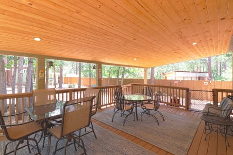 Enjoy your morning coffee on the porch, with two tables and a two seat glider.