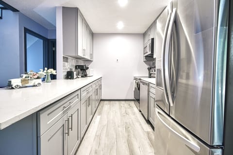 Indoors, Kitchen, Floor, Refrigerator, Microwave