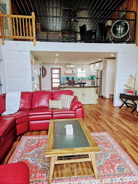 Open concept living room and kitchen.  Loft above.