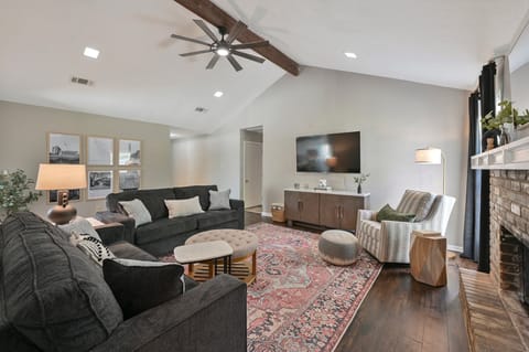 Living Room with 65" TV and Queen Sleeper Sofa