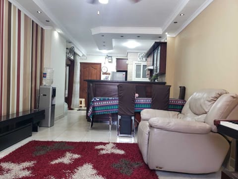 The apartment door, Kitchen, and open space.