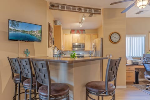 Sip coffee at the kitchen bar while watching the morning news.