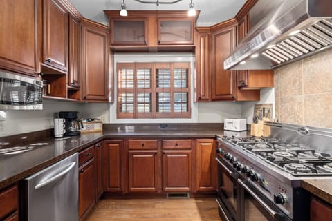 Fully equipped kitchen with modern stainless steel appliances