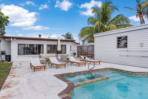 Relaxing pool with cozy sun loungers