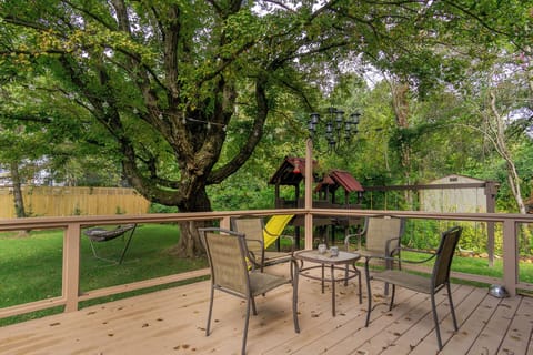 Ideal for families, the backyard includes playground equipment with a swing set and slide for children's enjoyment.