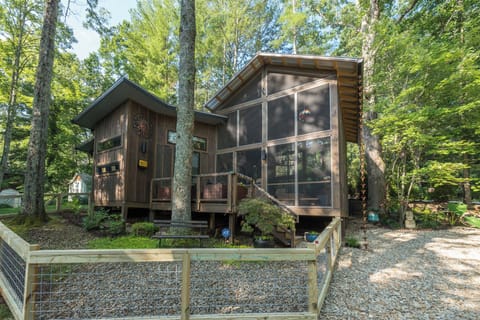 Quiet wooded setting with a covered screened porch and fenced yard.