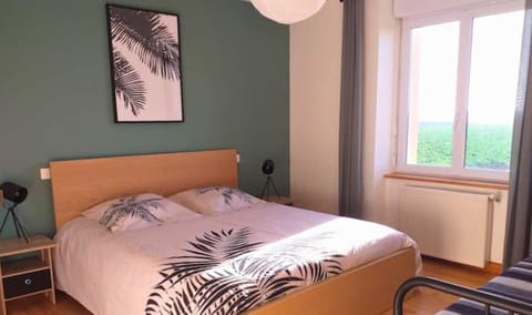 1st bedroom on the 1st floor: 1 queen-size bed, 1 single bed, dressing room, bedside tables