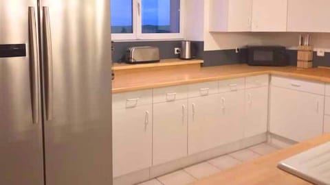 Large kitchen with American fridge