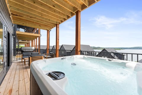 Relax outdoors on the deck with peaceful lake views while enjoying the private hot tub or warming up in the barrel sauna. It's the perfect spot to recharge and take in the scenery.