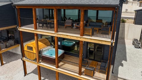 This lakeview deck offers the ultimate relaxation—hot tub, sauna, grill, and cozy seating all in one spot. Everything you need to relax!