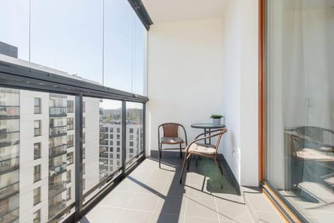 Furnished balcony with dining area.