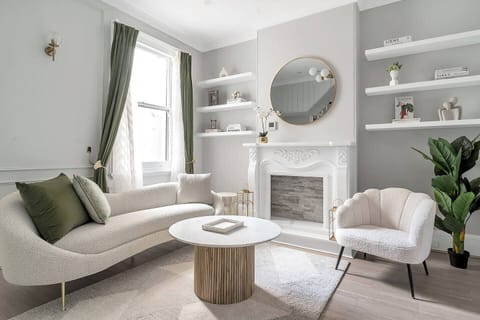 An elegantly styled living area with curated furnishings, soft neutral tones, and refined details—creating a polished yet inviting space to relax and unwind.