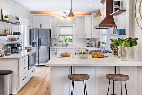 Gather, Cook, Connect – The oversized island invites conversation while you prep, snack, or sip something chilled.