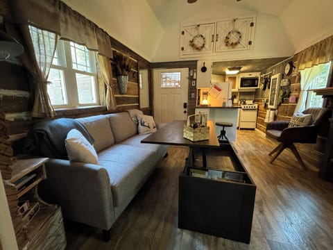 Coffee table top raises up for game playing or use as a table for eating