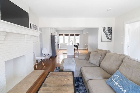 This comfy couch, complemented by sleek modern decor, creates the ultimate relaxing space.