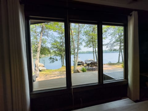 Enjoy meals with a view at the dining table overlooking the serene lake, offering a perfect setting for memorable dining experiences.