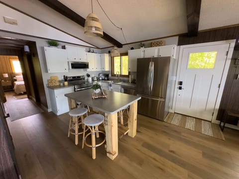 Cook up a feast in the modern kitchen equipped with all essential appliances, including a dishwasher and microwave, and a convenient island for dining.