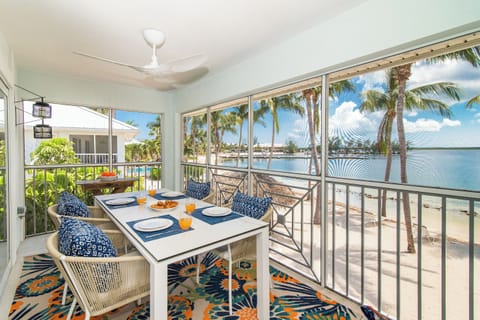 Beachfront dining on the screened balcony.