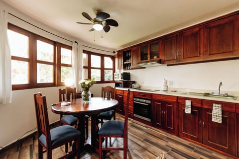 Your cozy dining area and kitchen complete with water heater/cooler. 