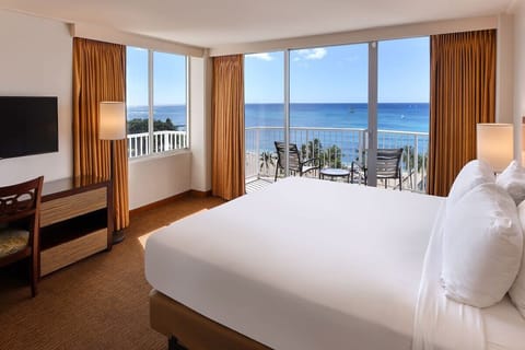 Step into your airy oceanview bedroom and instantly relax.