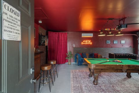 Garage has been converted into a Speakeasy with a bar and all the games.