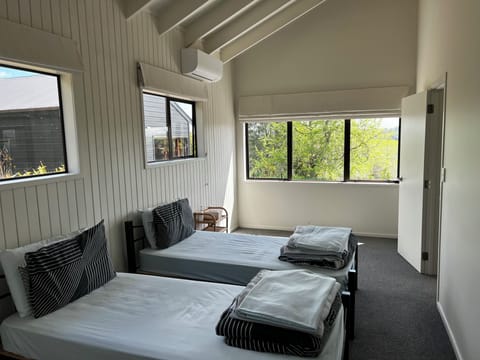 Two King single bed with a heat pump