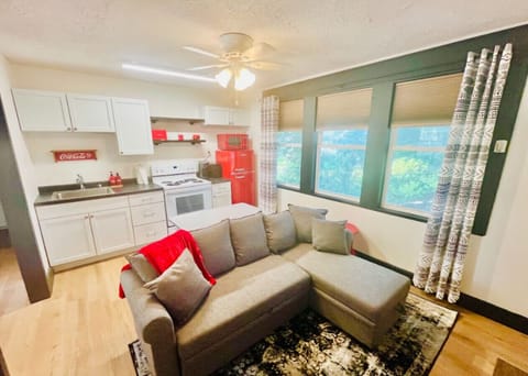 Welcome to the cozy living and dining area, where charm meets functionality. The open space is perfect for relaxing on the comfy couch, enjoying a meal at the dining table, or simply soaking in the cozy, elevated vibe. With stylish decor and thoughtful de