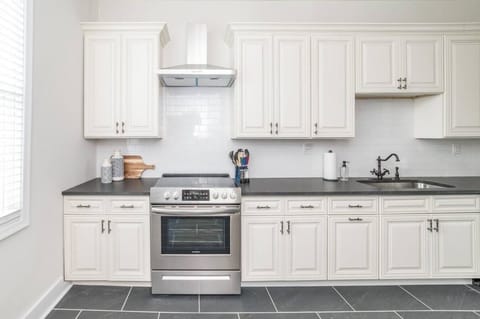 Sophisticated kitchen includes stainless appliances