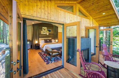 Relax on a charming porch that seamlessly blends indoor comfort with outdoor beauty.