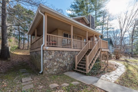 A welcoming bungalow-style home nestled in a quiet neighborhood, featuring a classic facade and a beautifully landscaped front yard.