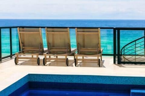 Enjoy poolside cocktails and panoramic views of the beach.