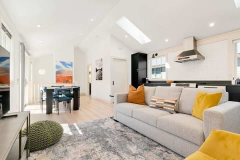 Clean design and open flow. Easy to move between the kitchen, dining, and living areas.