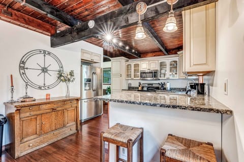 Step into the kitchen, a vibrant hub of culinary creativity featuring modern appliances and plenty of counter space for all your cooking adventures.