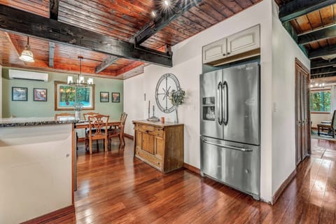 Experience the charm of our large dining table, ideal for preparing and enjoying meals in this warm, welcoming space designed for unforgettable gatherings.