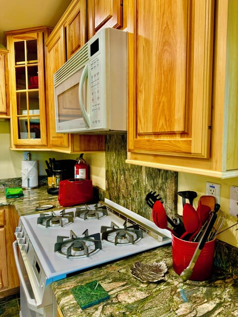 The kitchen has everything a cook needs with all appliances & cookware, etc.