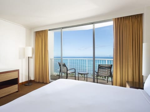 Wake to ocean breezes from your bed and private balcony.